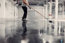 Liquid-applied waterproofing across an internal floor area.